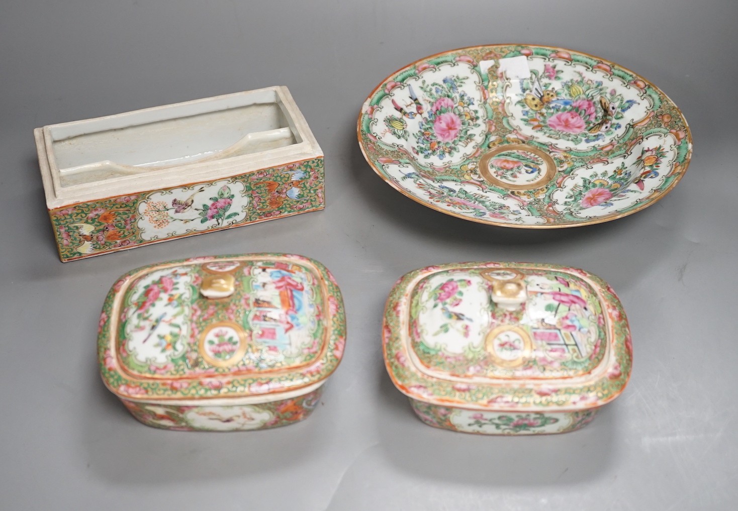 A group of 19th century Chinese famille rose porcelain - two soap dishes, strainers and covers, a plate and a pen box base